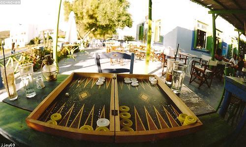 People playing board games at a cafe table