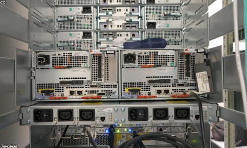 Rows of server hardware in a dim data center