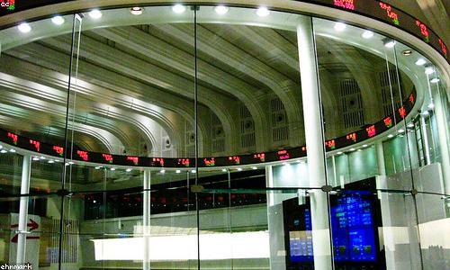 Traders shouting orders on a busy exchange floor