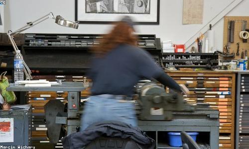 Close-up of metal type in a printing tray